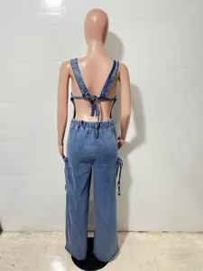 Backless denim jumpsuit with wide legs and cargo pockets, sexy casual overalls style detail.
