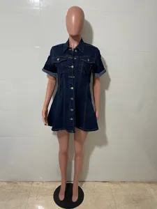 Dark blue denim shirt dress detail, featuring lapel collar and button-down front style.