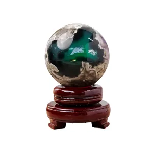 Natural volcanic agate crystal sphere with dark wooden base for exquisite home decor display.