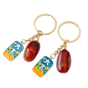Chinesischer Stil naturachat Trommelstein und glückliche Orangen Emaill Schlüsselanhänger.