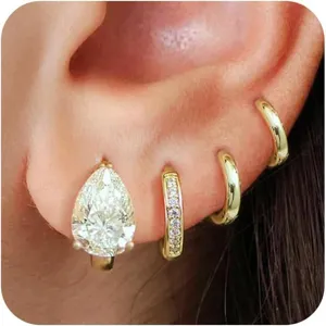 Gold-plated brass pear-cut cubic zirconia huggie hoop earrings set for chic daily wear.