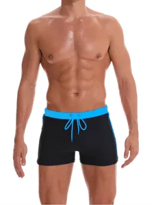 Men's comfortable breathable nylon solid color flat-corner swim trunks with contrast drawstring.