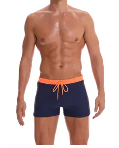 Men's solid color swim trunks, comfortable breathable athletic nylon board shorts with drawstring.