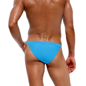 Men's blue swim briefs detail view, showing high-elasticity fabric and slim fit design.