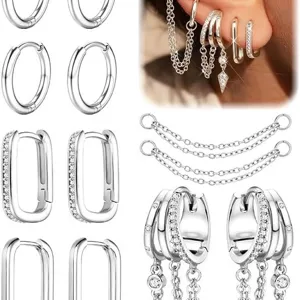 Set di orecchini a cerchio geometrici argentati con catene di cristalli per look alla moda.