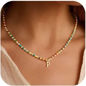 Close-up detail of a colorful beaded necklace featuring a gold letter P pendant and vibrant beads.