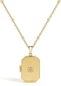 Gold locket necklace with sparkling zircon stone detail, elegant brass chain pendant.