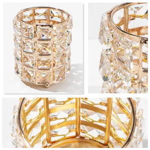 Crystal makeup brush holder close up, luxury gold metal and sparkly transparent glass design.