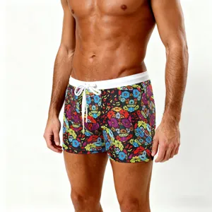 Men's floral skull print boxer swim trunks with white drawstring and side split design.