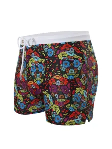 Men's boxer swim trunks with vibrant floral skull print, white elastic waist and drawstring.