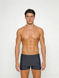 Men's solid color square leg swim trunks detail, featuring quick dry and comfortable fit.