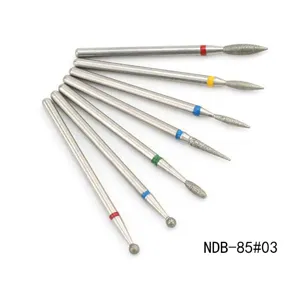 Detail shot of 7 piece nail drill bits set with colorful rings for manicure removal and shaping.