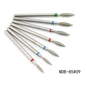Diamond nail drill bits detail view, set of 7 pieces with color rings for professional manicure use.