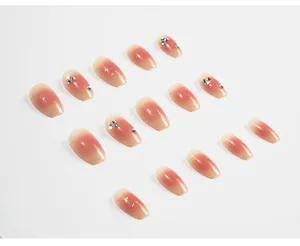 Set de uñas postizas press-on degradadas blush con pedrería brillante, puntas de uñas largas.