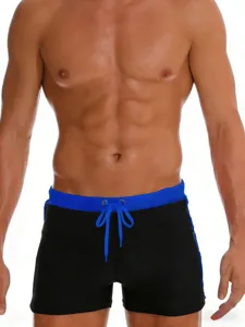 Men's solid color slim fit boxer brief swim trunks with drawstring for beach vacation.