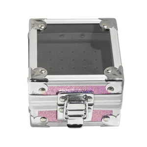 Pink glitter aluminum storage box detail view with transparent acrylic lid and metal clasp lock.