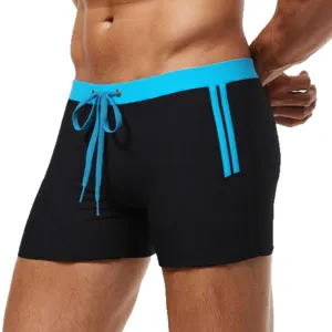 Men's contrast color swimming trunks featuring blue drawstring waist and stylish side stripes.
