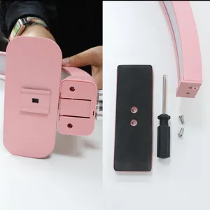 Detail of pink half moon nail lamp assembly, U shaped beauty light parts and screws.