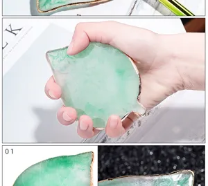 Leaf shaped resin agate nail art palette with gold edge for professional gel polish color mixing.