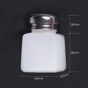 Nail polish remover bottle detail view, empty white plastic container with metal pump.
