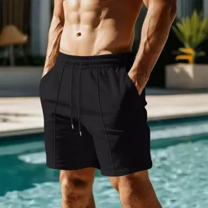 Men's quick-drying solid black beach shorts with drawstring, comfortable summer swimwear.