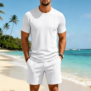 Detailed view of the white waffle knit short sleeve t shirt and shorts set on beach backdrop.