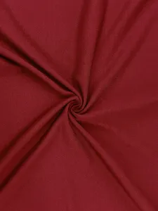 Dark red fabric detail texture closeup for men's casual short sleeve t-shirt top apparel.
