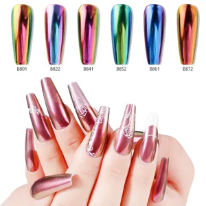 Detail shot of chrome mirror nail powder effects on artificial tips and hands with rose art.