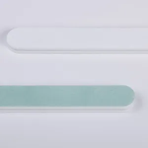 Double-sided nail file and buffer block detail, professional manicure grinding and shaping tool.