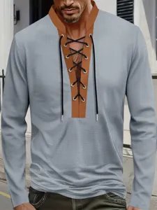 Detail view of men waffle knit long sleeve shirt featuring contrast lace up stand collar design.