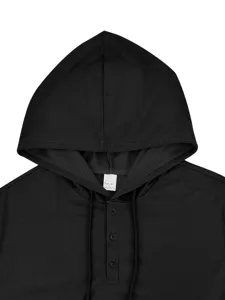 Detailed close up view of black short sleeve hooded henley shirt collar and buttons.