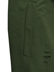 Close-up detail of dark green casual shorts featuring pocket design and distressed ripped slits.