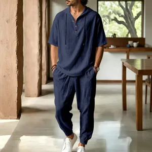 Detailed view of men's casual linen hooded short sleeve shirt and lounge pants set in deep navy.