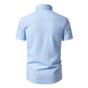 Back view detail of casual light blue short sleeve shirt with shoulder yoke and collar.