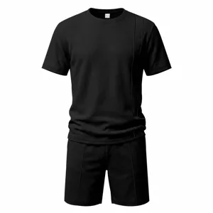 Detailed view of the black waffle knit short sleeve t-shirt and shorts set texture.