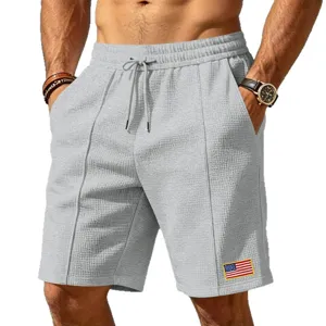Men casual waffle knit shorts with drawstring elastic waist and flag patch for summer active wear.