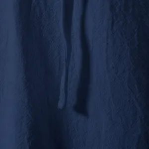 Men casual cotton linen short sleeve henley shirt fabric detail in dark blue color.