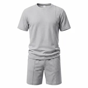 Gray waffle knit short sleeve t-shirt and shorts set detail, casual summer menswear outfit.