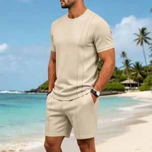 Detail view of men's casual waffle knit short sleeve t-shirt and shorts set in beige.
