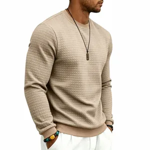 Detailed view of men's casual textured waffle knit crewneck sweatshirt in solid khaki color.