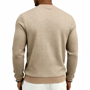 Back detail view of men long sleeve crewneck waffle textured knit fabric close up.