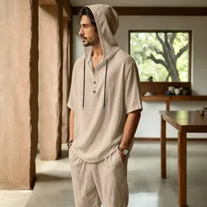 Detail shot of breathable men's linen hooded shirt and pants set for summer vacation.