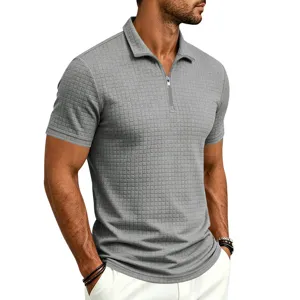 Detailed view of the casual grey grid textured half-zip short sleeve polo shirt for men.