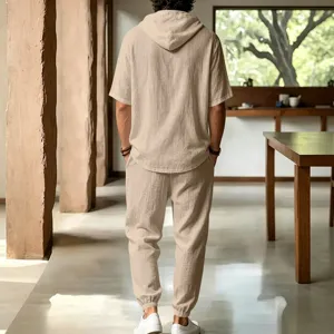 Back view detail of mens casual loose linen hooded short sleeve top and trousers set beige.