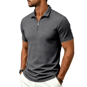 Detailed shot of men's dark gray waffle textured short sleeve polo shirt with zipper collar.