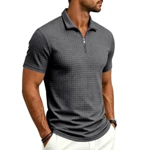 Close-up detail of men's short-sleeve grid zip polo shirt, showing textured jacquard fabric.