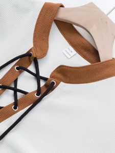 Men's waffle knit long sleeve shirt with brown contrast collar and black lace up drawstring.