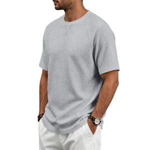 Casual waffle knit short sleeve t-shirt detail, breathable mens crew neck grey top view.