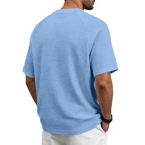 Men light blue waffle knit short sleeve t-shirt back detail showing breathable fabric texture.