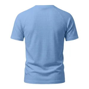 Back view of light blue men's short sleeve waffle knit t-shirt, showing texture and fit.